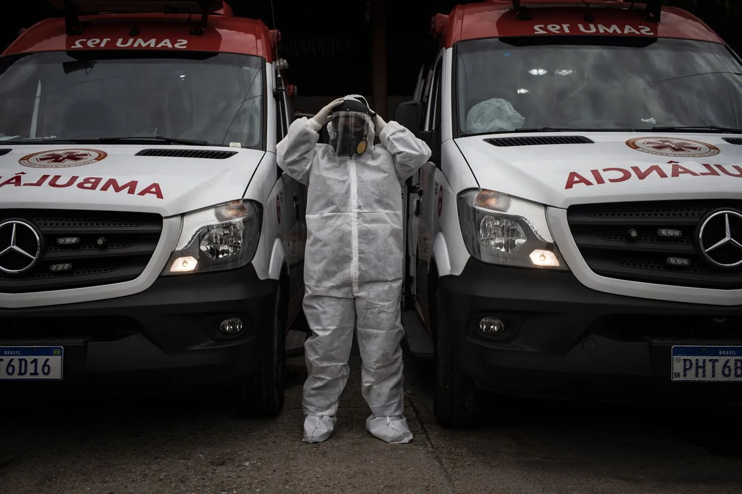 Emergency physician Alessandra Said dons personal protective equipment in preparation to attend to a patient with covid-19. (Raphael Alves for The Washington Post)