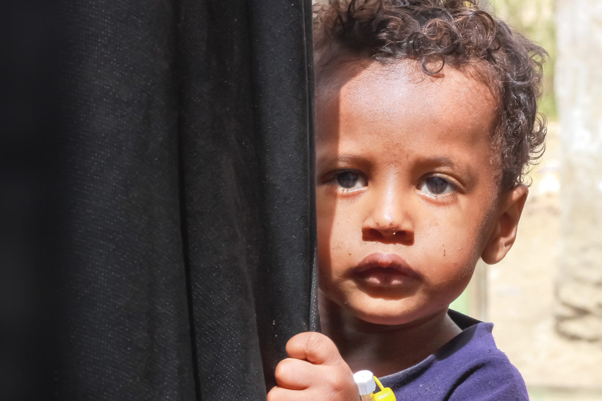 A young child urgently in need of emergency aid.