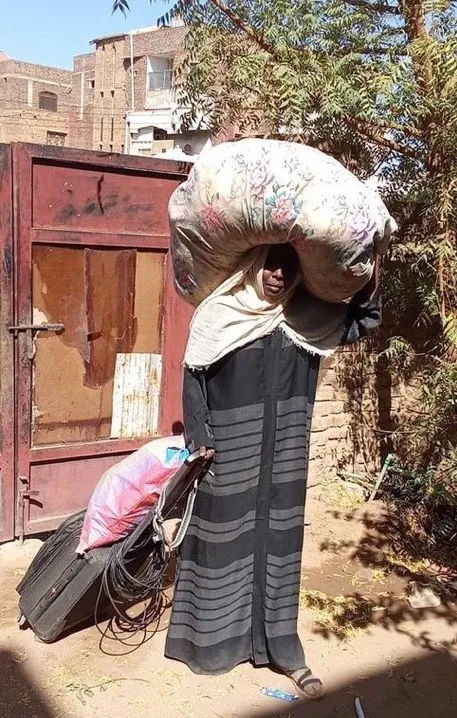 A woman carrying bags on her head