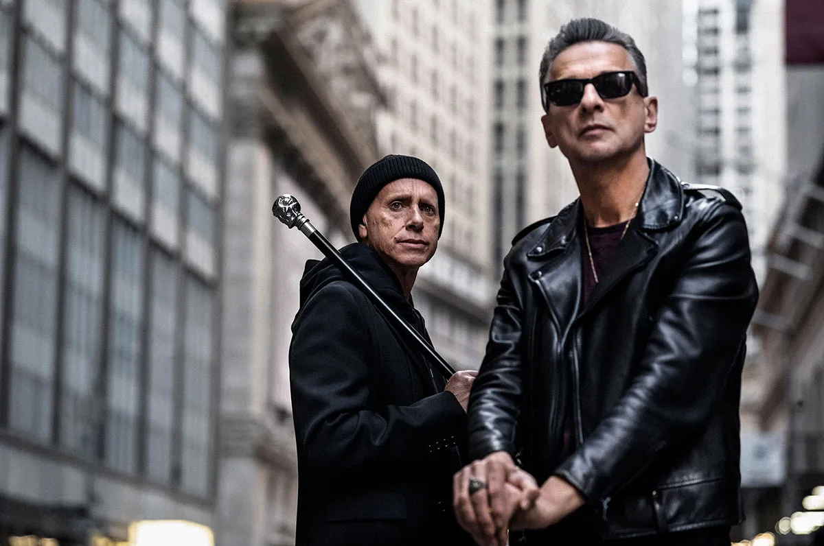 Depeche Mode posing with their instruments in New York.