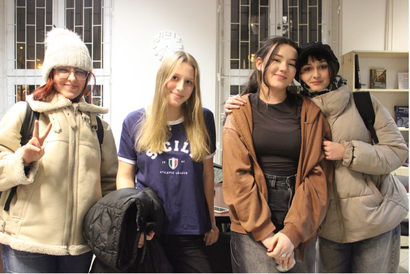 Portrait of four teenage girls, all smiling.