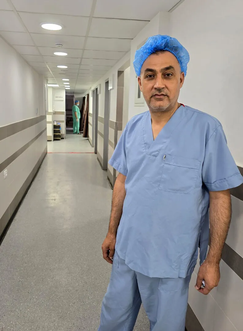 A male doctor in scrubs.