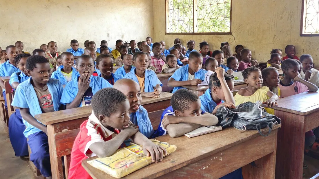 A group of children in a classroom in Mozambique.