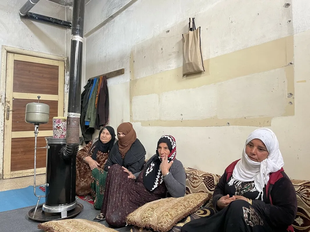 A group of internally displaced Syrian women in a school turned into a temporary shelter.