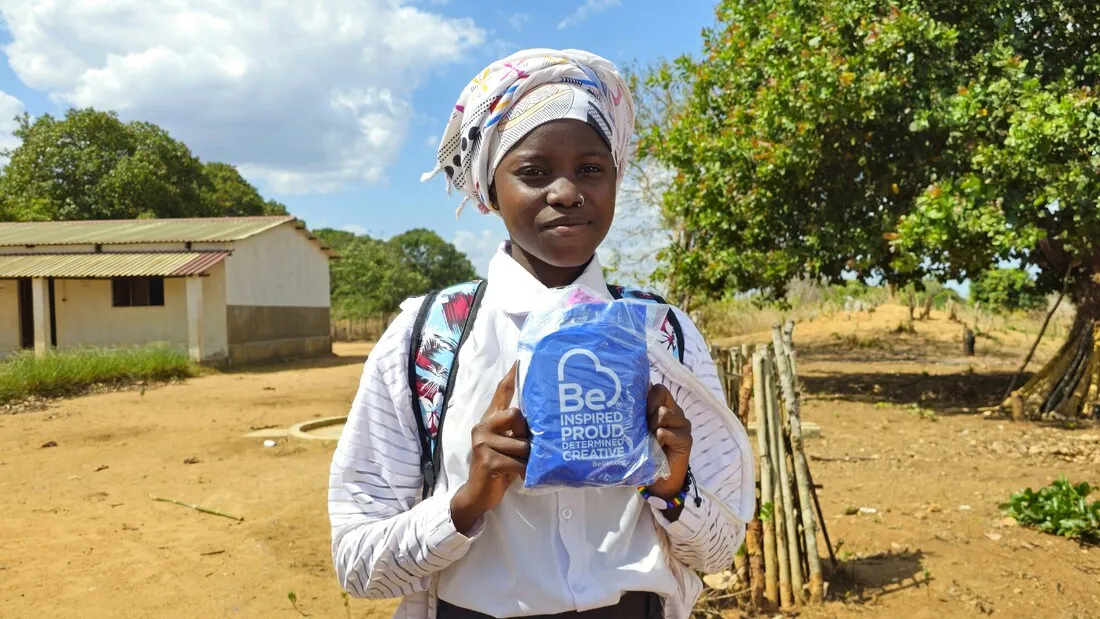 Farsana shows her menstrual hygiene kit received from CARE.