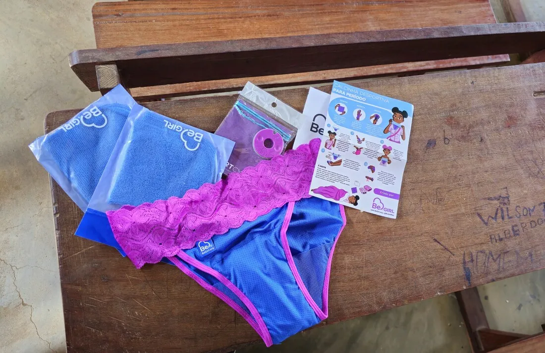 Menstrual hygiene kit from CARE that includes underwear, three washable cloths pads, and a cycle tracker.