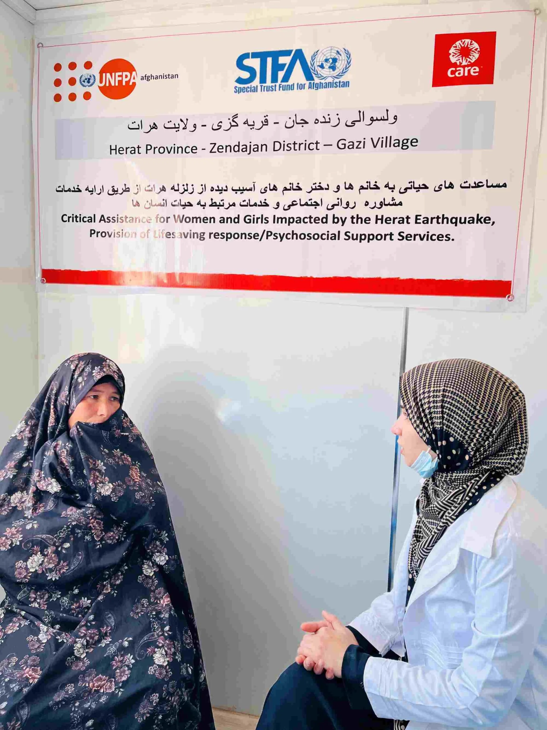 An Afghan woman named Maryam, an earthquake survivor, attends a psychosocial counseling session with a female counselor.