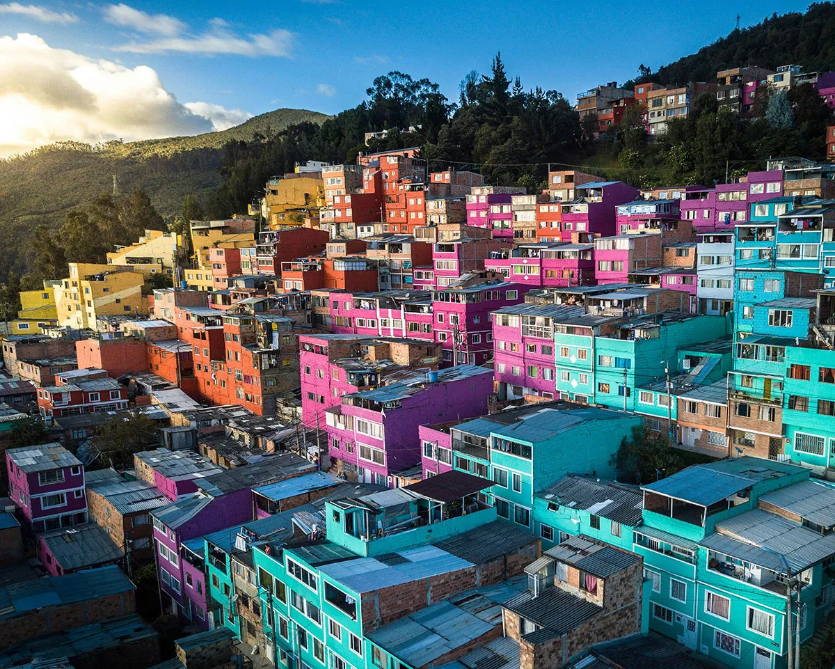 A colorful array of building painted bright blue, pink, and orange.