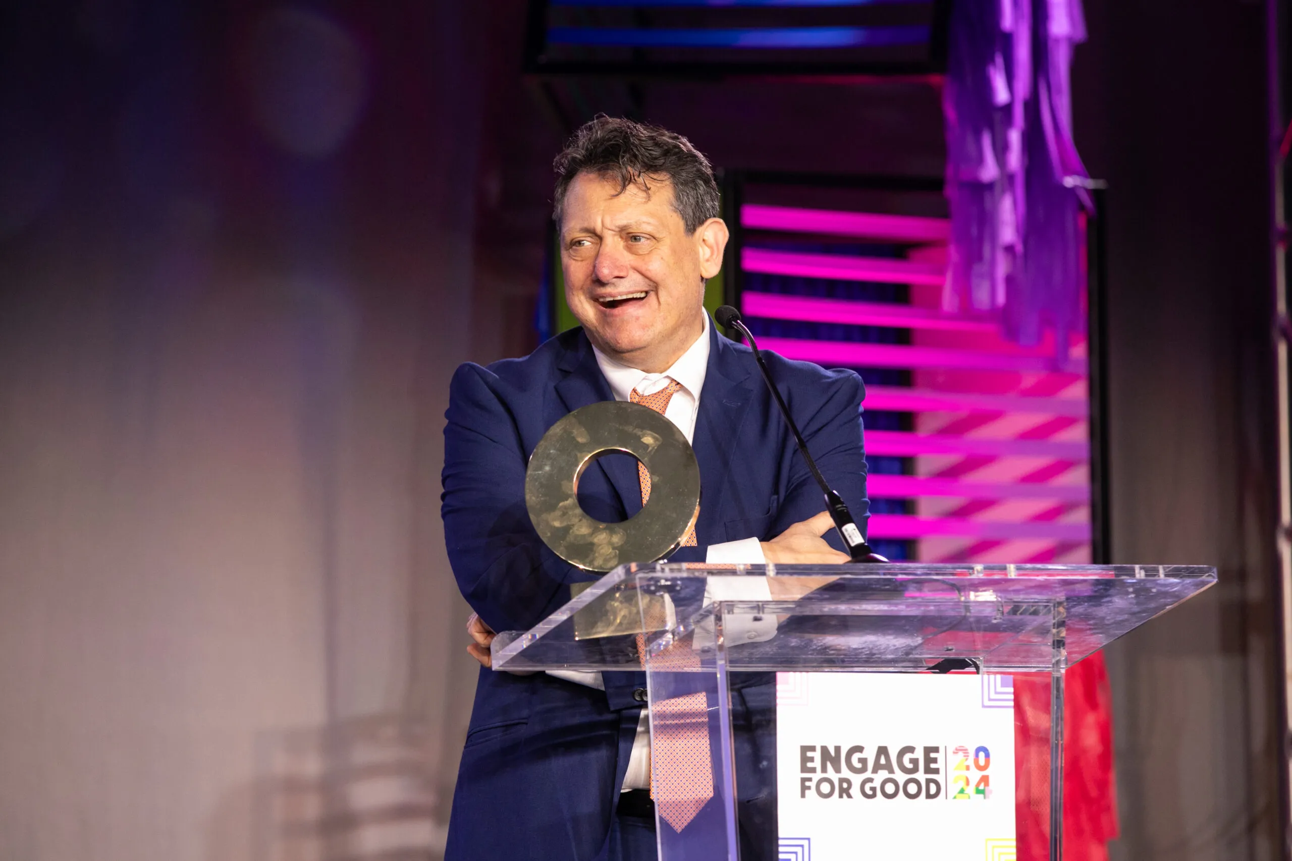 Man at podium accepting an award