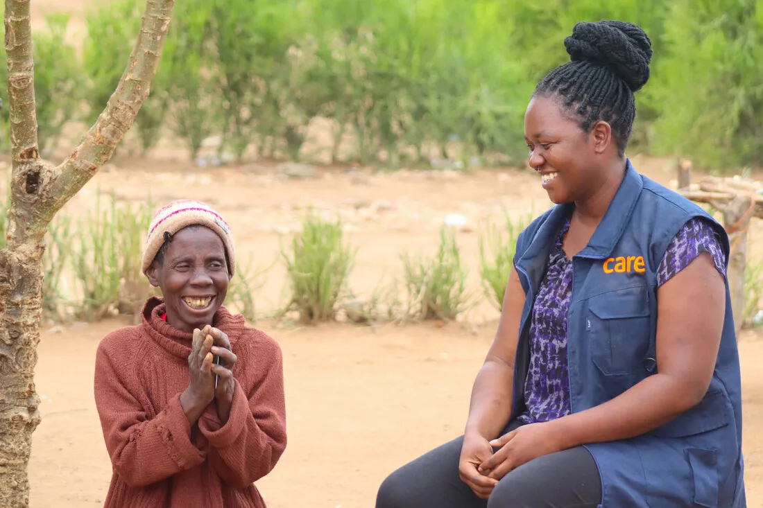 Mwaedza, a Zimbabwean woman, beams with joy as she sees her nearly finished home.